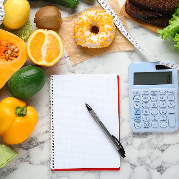 Food Products, Notebook With Calculator On White Marble Table, F
