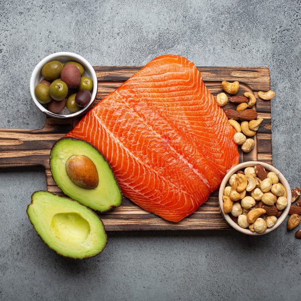 Food sources of healthy unsaturated fat: fresh raw salmon fillet, avocado, olives, nuts